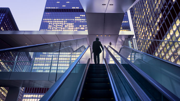 Business person escalator buildings