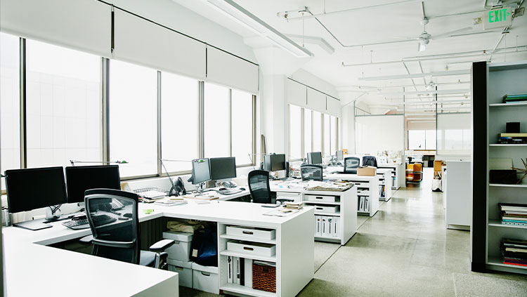 Empty office space desks chairs