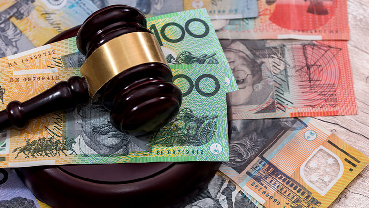 Gavel laying on money