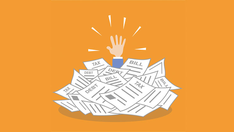 Hand reaching out pile tax papers