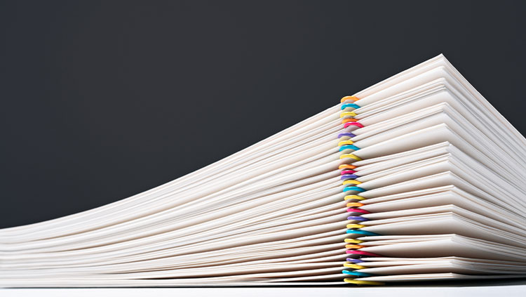 Stack of papers with paperclips