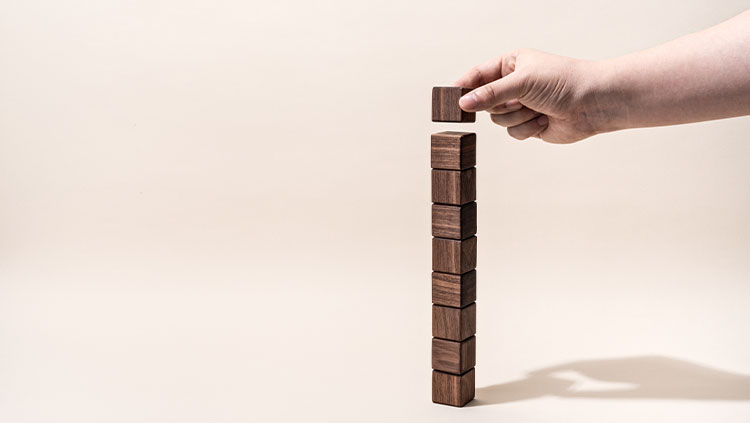 Stacking wooden blocks in tower