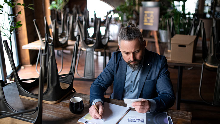 Cafe person concerned paperwork