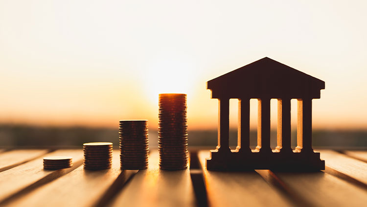 Sunset outline bank shape stacks coins