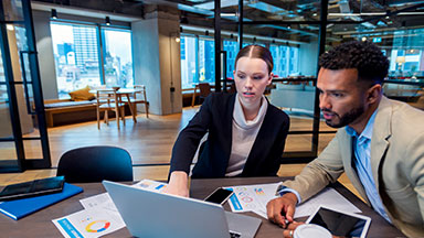 Two business people working laptop