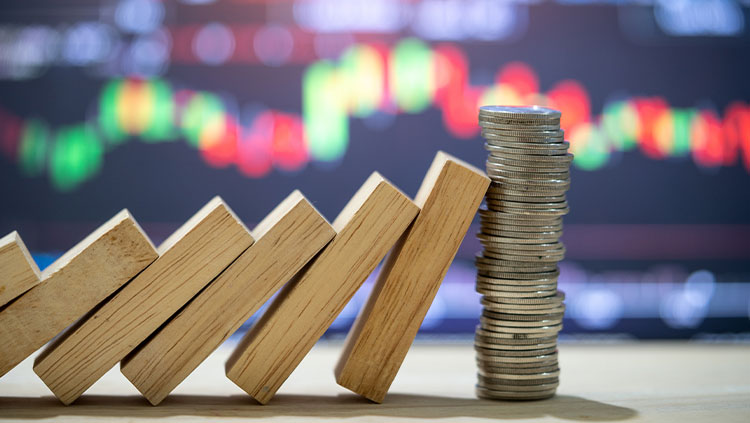 Wooden blocks falling onto stack coins
