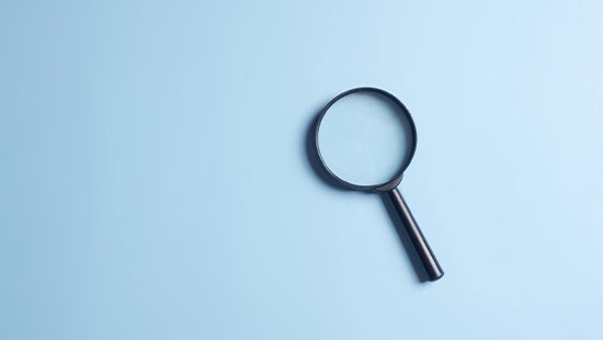 Magnifying glass blue background