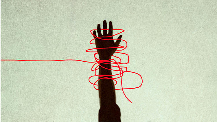 Hand red string wrapped around