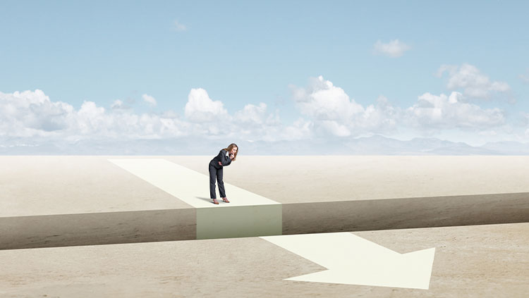 Person looking down gap in path