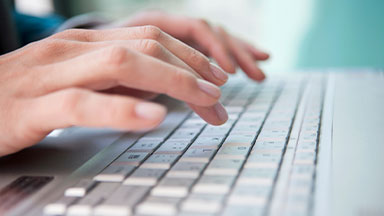 Person typing keyboard