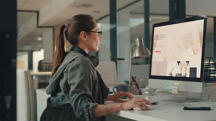 Person working at desk computer