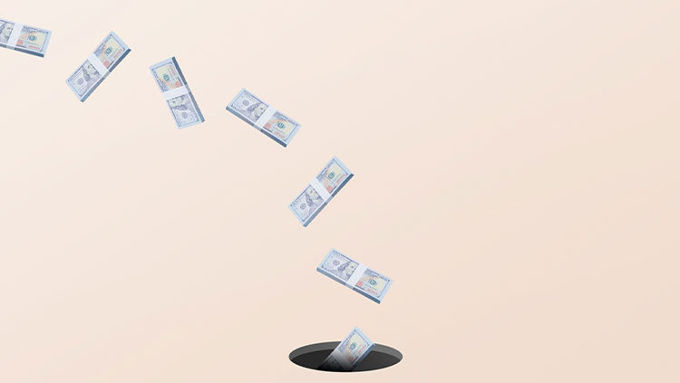 Money flying down drain