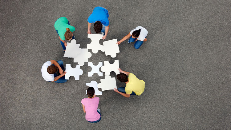 People working together jigsaw floor