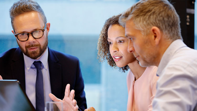 Three people office meeting