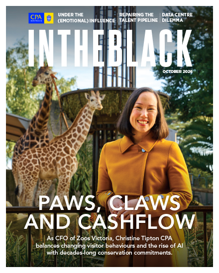 In The Black magazine cover, October 2026, featuring Christine Tipton with giraffes and the headline 'Paws, claws and cashflow'